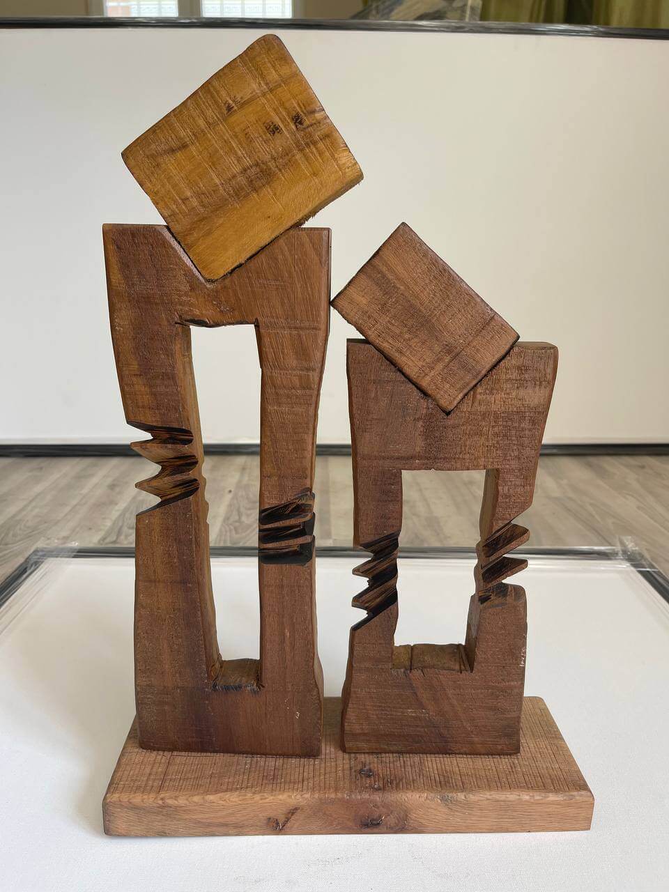 Modernist wooden sculpture with flowing lines