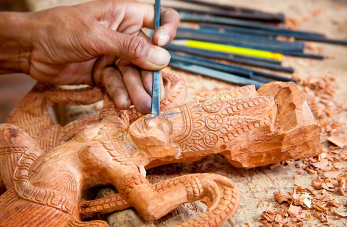 Master craftsman carving wood