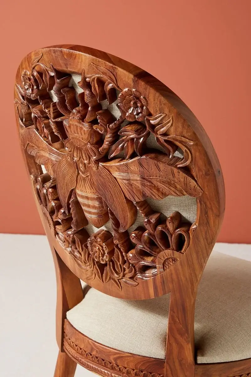 Luxurious, custom-carved wooden chair in a stylish interior