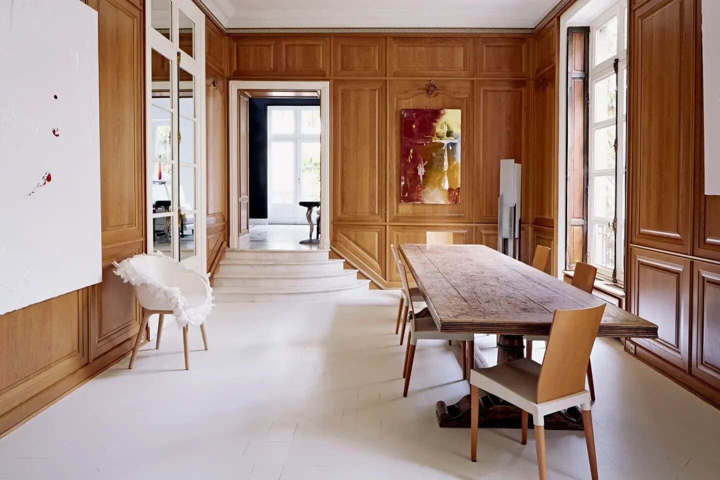 A library with floor-to-ceiling carved wood paneling
