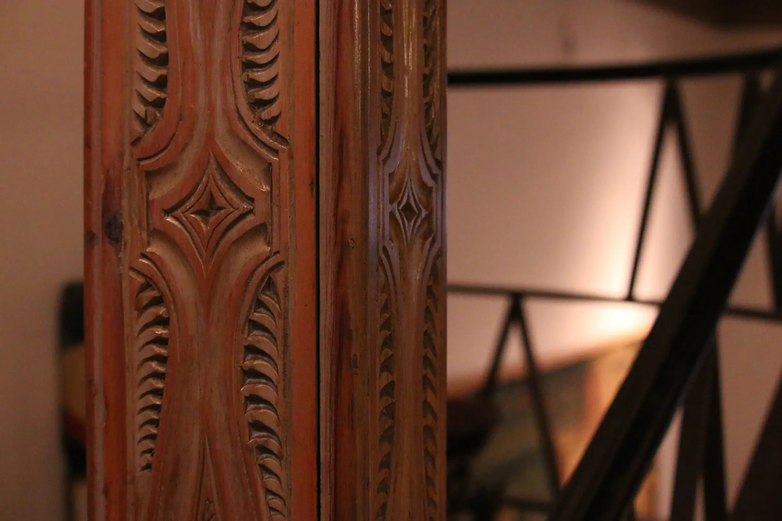 A detailed close-up of a carved ceiling beam